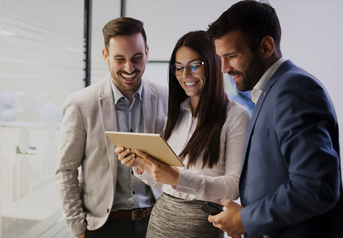Colleagues reviewing business information on a tablet