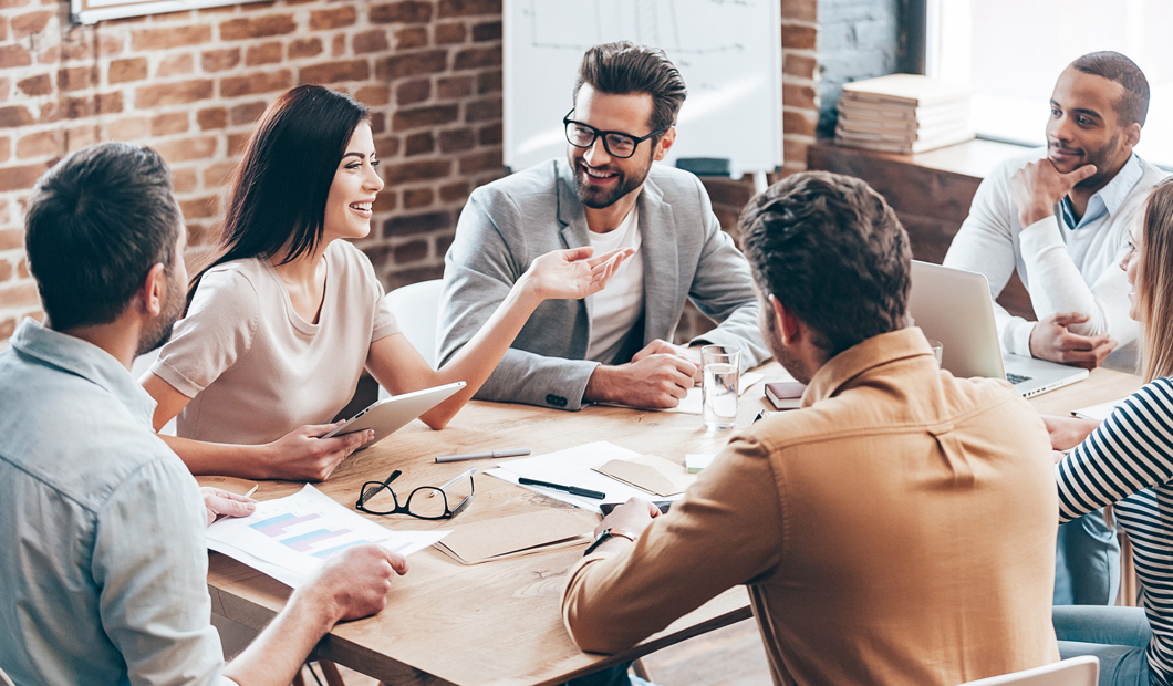 Small-business team collaborating around a conference table